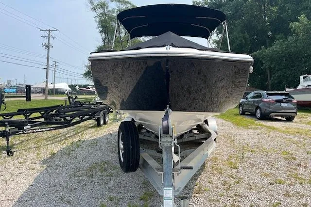 Slide: The Image of 2021 Yamaha Boats 275 SE on trailer, parked outdoors, front view. - 4