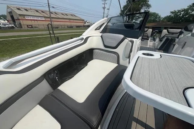 Slide: The Image of 2021 Yamaha Boats 275 SE interior with sleek seating and modern design. - 40