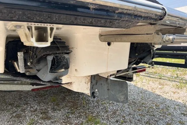 Slide: The Image of 2021 Yamaha Boats 275 SE jet propulsion system on gravel surface. - 9