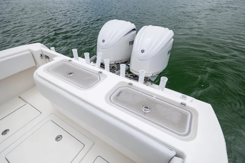 Slide: The Image of 2012 Contender 30 Tournament boat with dual Yamaha outboard engines on water. - 11