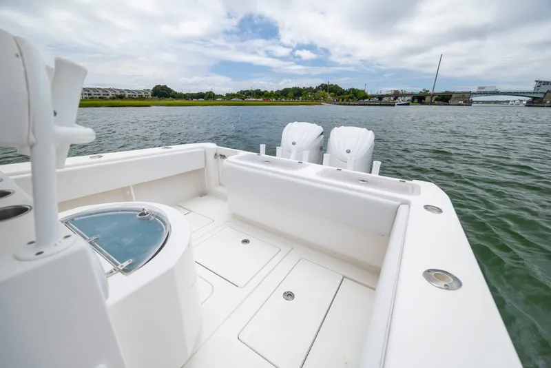 Slide: The Image of 2012 Contender 30 Tournament boat on water, featuring dual engines and spacious deck. - 16