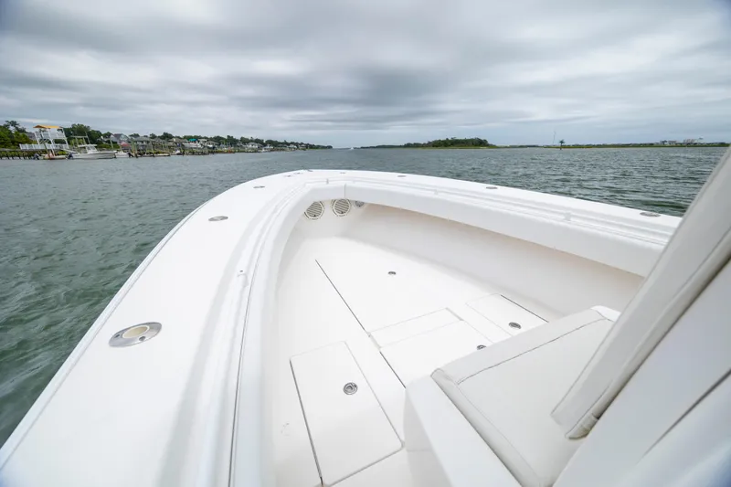 Slide: The Image of 2012 Contender 30 Tournament boat on calm waters under cloudy skies. - 21