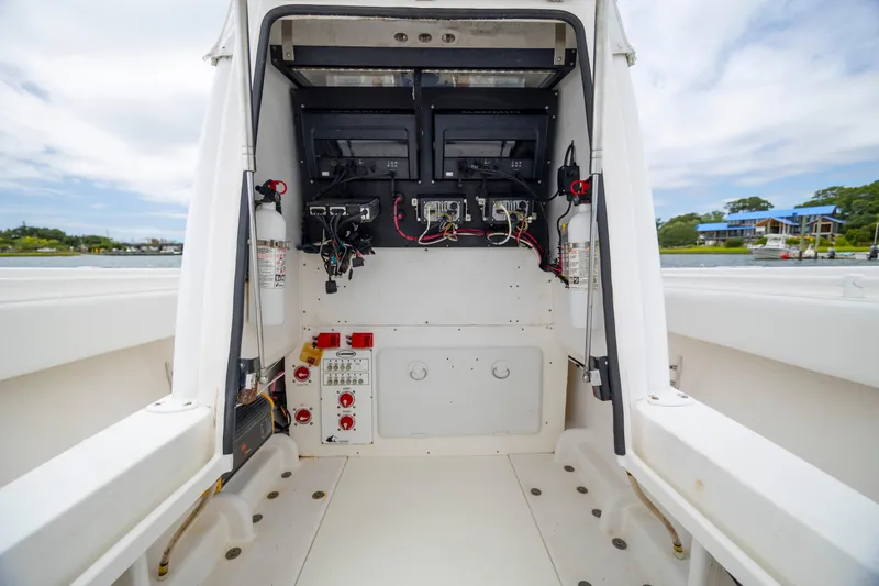 Slide: The Image of 2012 Contender 30 Tournament boat console with electronic equipment and wiring. - 27