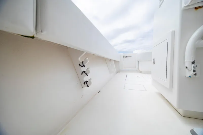 Slide: The Image of 2012 Contender 30 Tournament boat interior with storage compartments and rod holders. - 28