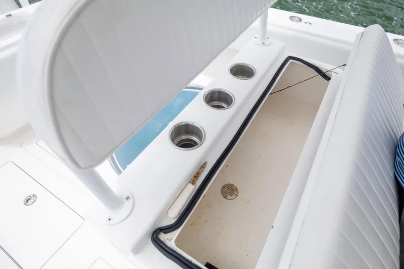 Slide: The Image of 2012 Contender 30 Tournament boat interior with storage compartment and cup holders. - 29