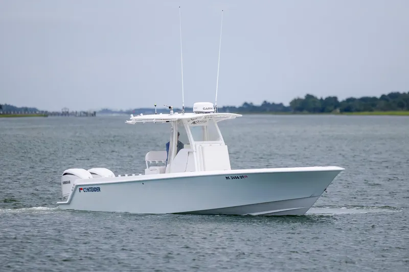 Slide: The Image of 2012 Contender 30 Tournament boat cruising on calm waters. - 3