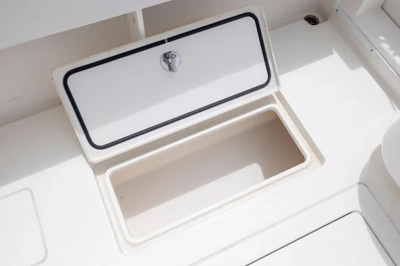 Slide: The Image of Open storage compartment on 2012 Contender 30 Tournament boat deck. - 30