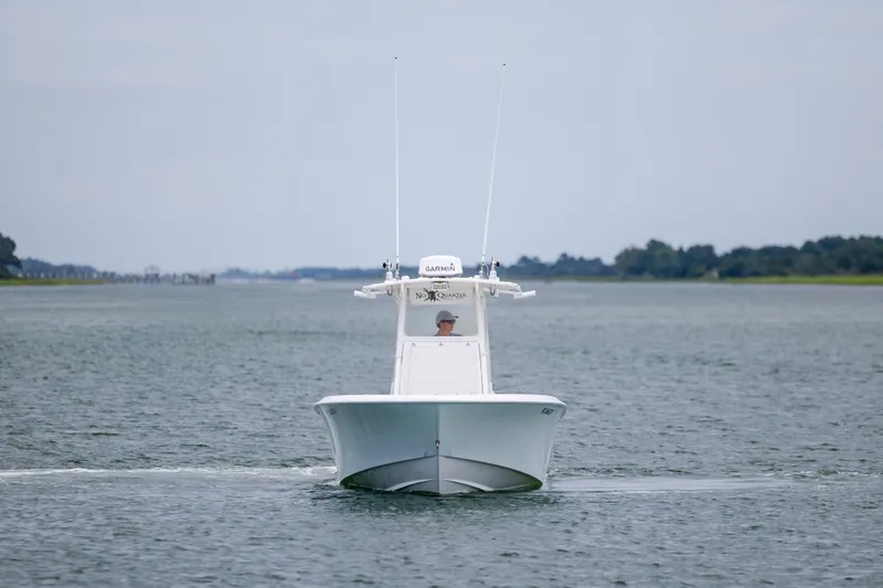 Slide: The Image of 2012 Contender 30 Tournament boat cruising on calm water. - 4