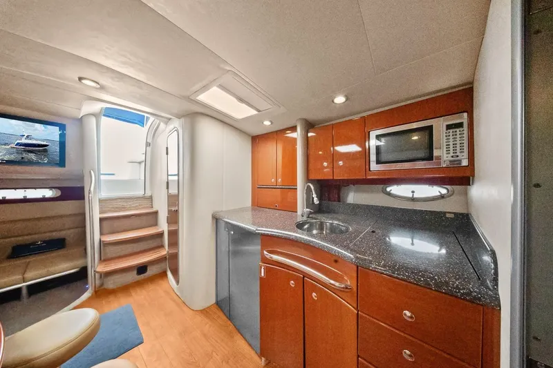 Slide: The Image of 2008 Formula 40 Performance Cruiser interior with modern kitchen and seating area. - 12