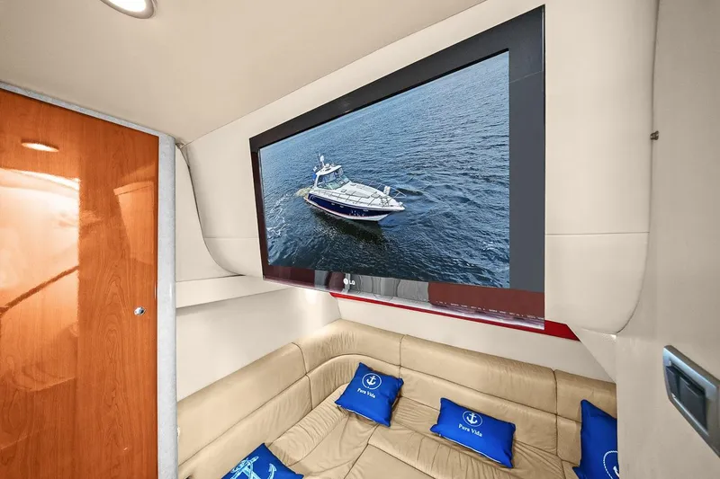 Slide: The Image of Interior of 2008 Formula 40 Performance Cruiser with TV and beige seating. - 13