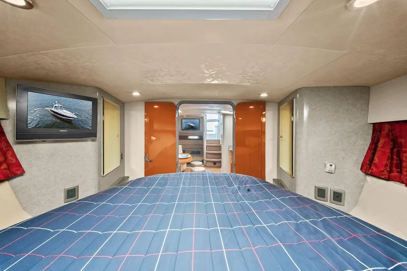 Slide: The Image of 2008 Formula 40 Performance Cruiser cabin with bed, TV, and modern interior design. - 14