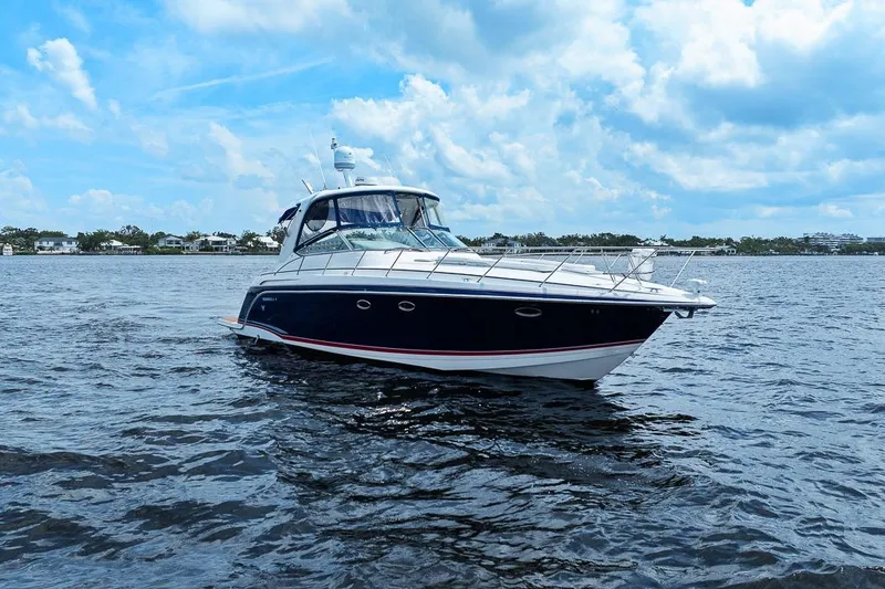 Slide: The Image of 2008 Formula 40 Performance Cruiser on open water under a partly cloudy sky. - 20