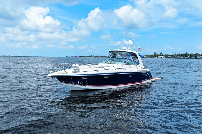 Slide: The Image of 2008 Formula 40 Performance Cruiser on open water under a blue sky. - 21