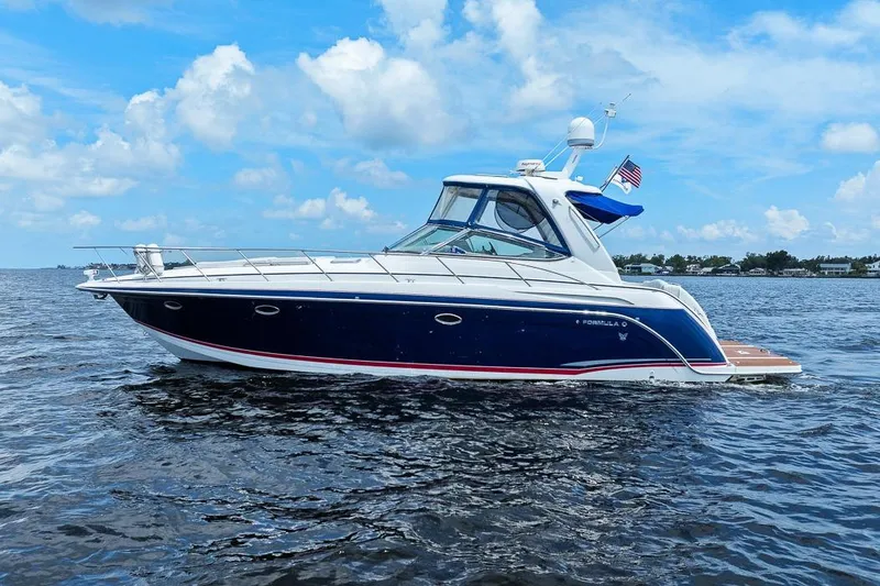 Slide: The Image of 2008 Formula 40 Performance Cruiser on open water under blue sky. - 22