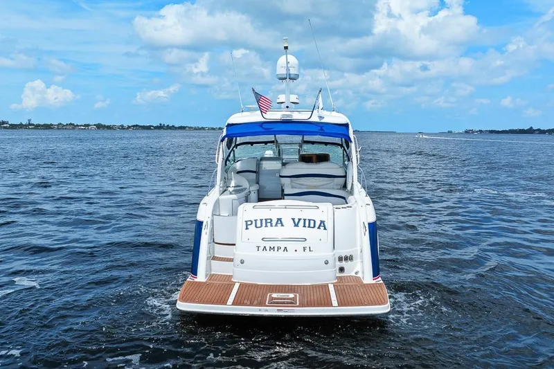 Slide: The Image of 2008 Formula 40 Performance Cruiser on open water, rear view, "Pura Vida" name visible. - 25