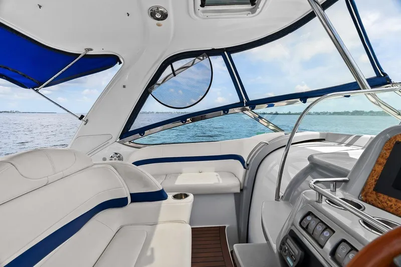 Slide: The Image of 2008 Formula 40 Performance Cruiser interior with blue accents, overlooking serene ocean view. - 31