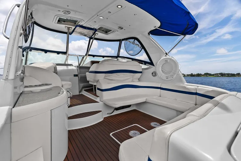 Slide: The Image of 2008 Formula 40 Performance Cruiser interior with white seating and blue accents on a sunny day. - 35