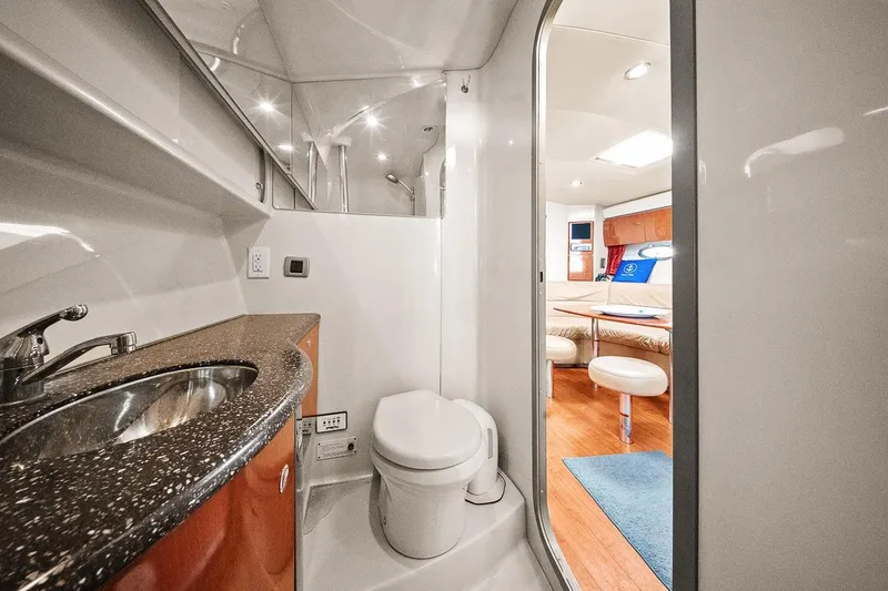 Slide: The Image of 2008 Formula 40 Performance Cruiser bathroom with modern sink and toilet, leading to cozy cabin. - 5