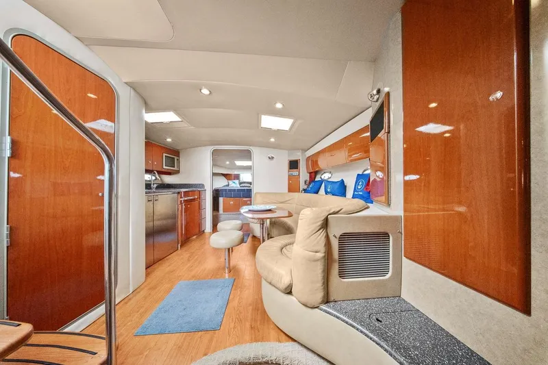 Slide: The Image of Luxurious interior of a 2008 Formula 40 Performance Cruiser with modern amenities and wood finishes. - 7