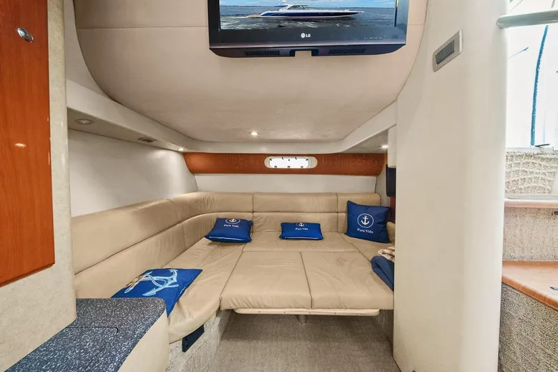 Slide: The Image of Interior of 2008 Formula 40 Performance Cruiser with beige seating and nautical decor. - 8