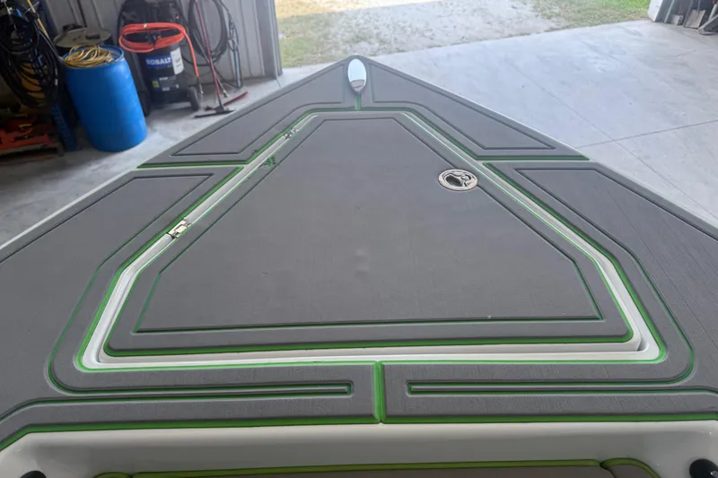 Slide: The Image of Bow of 2019 Statement 350 Open boat with sleek design and green accents. - 13