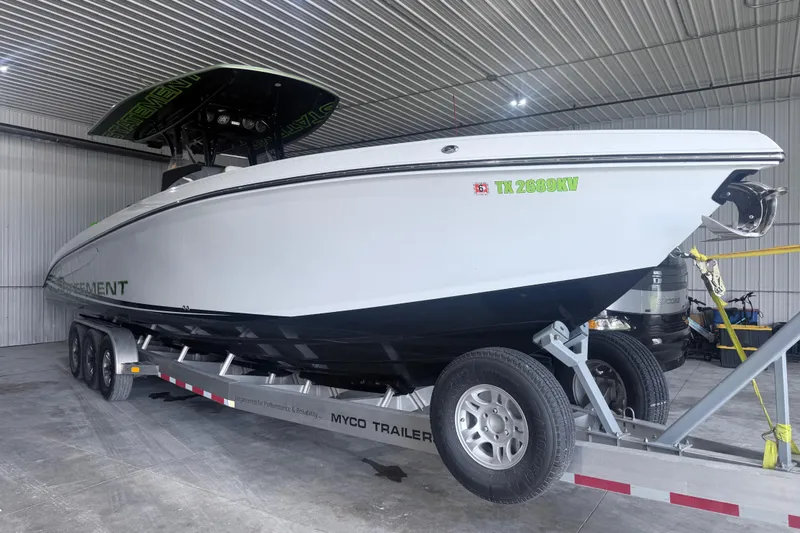 Slide: The Image of 2019 Statement 350 Open boat on trailer in a garage setting. - 4