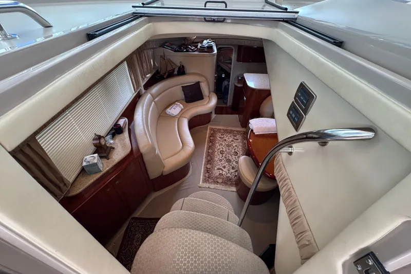Slide: The Image of Interior of 2004 Sea Ray 390 Motor Yacht with elegant seating and decor. - 21
