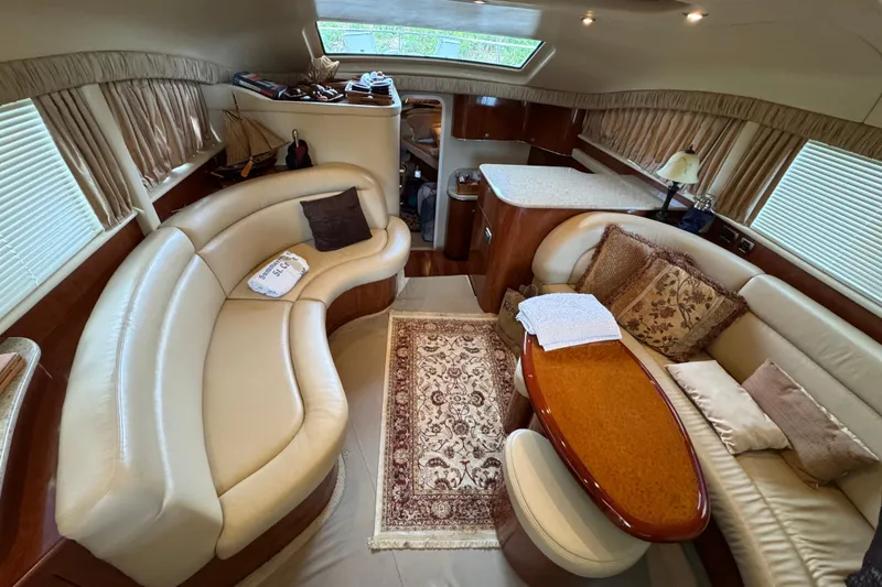 Slide: The Image of Luxurious 2004 Sea Ray 390 Motor Yacht interior with elegant seating and decor. - 22