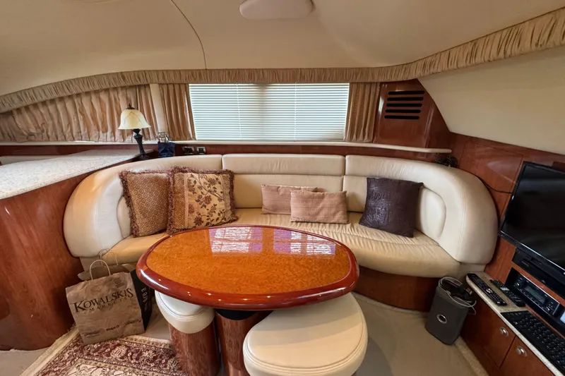 Slide: The Image of Luxurious interior of 2004 Sea Ray 390 Motor Yacht with elegant seating and decor. - 23