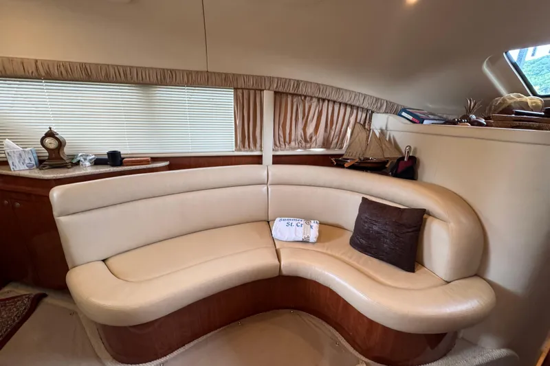 Slide: The Image of Luxurious interior of 2004 Sea Ray 390 Motor Yacht with curved leather seating. - 25