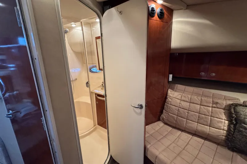 Slide: The Image of 2004 Sea Ray 390 Motor Yacht interior with shower and cozy seating area. - 45