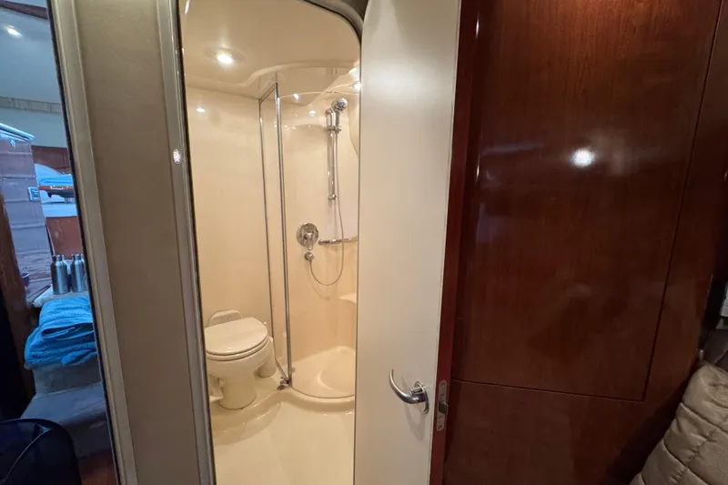 Slide: The Image of 2004 Sea Ray 390 Motor Yacht bathroom with shower and toilet. - 46