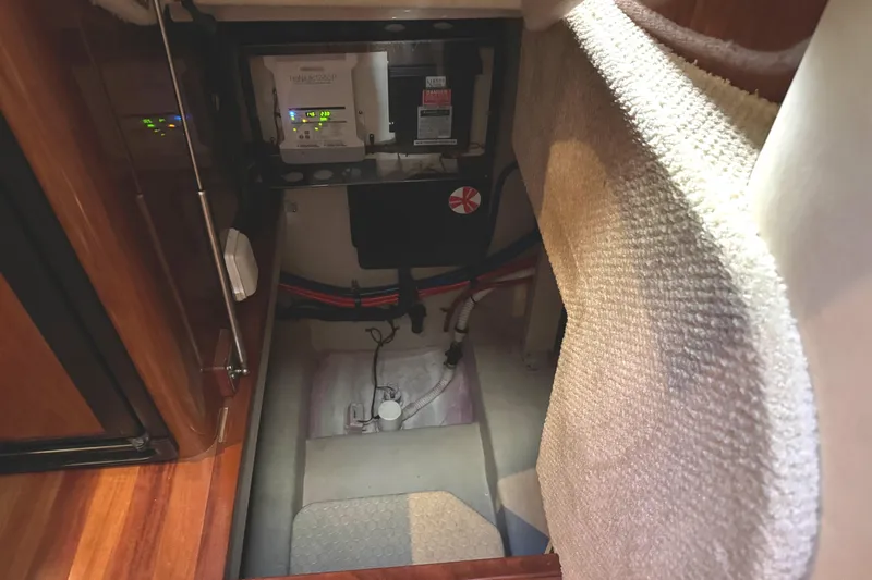 Slide: The Image of 2004 Sea Ray 390 Motor Yacht interior showing electrical panel and wiring. - 47