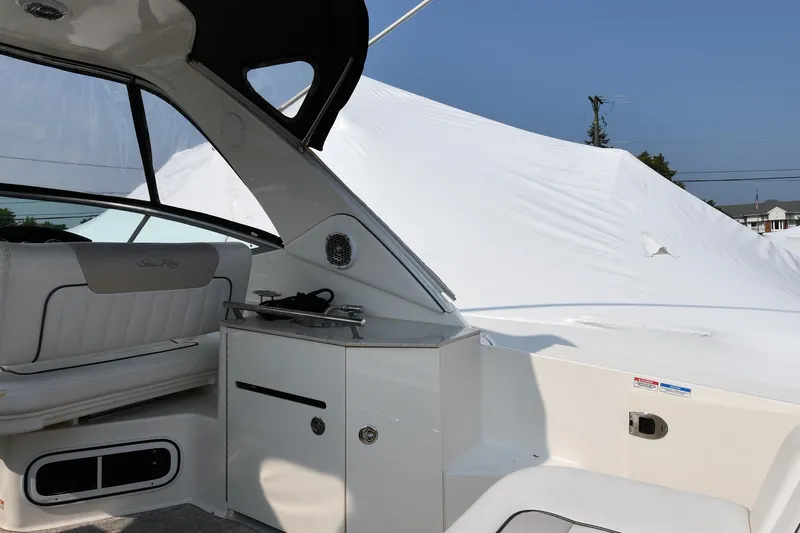 Slide: The Image of Interior view of a 2011 Sea Ray 310 Sundancer boat with seating and cabinetry. - 19