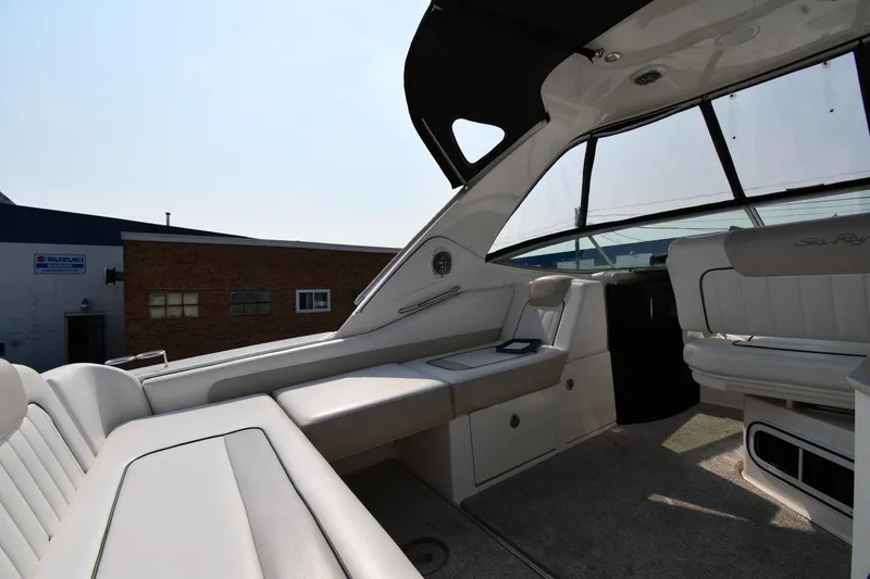 Slide: The Image of 2011 Sea Ray 310 Sundancer interior with white seating and modern design. - 20