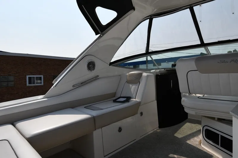 Slide: The Image of 2011 Sea Ray 310 Sundancer interior with white seating and modern design. - 21