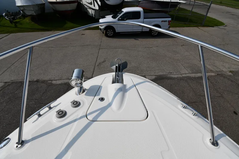 Slide: The Image of Bow view of 2011 Sea Ray 310 Sundancer with spotlight and railing. - 30