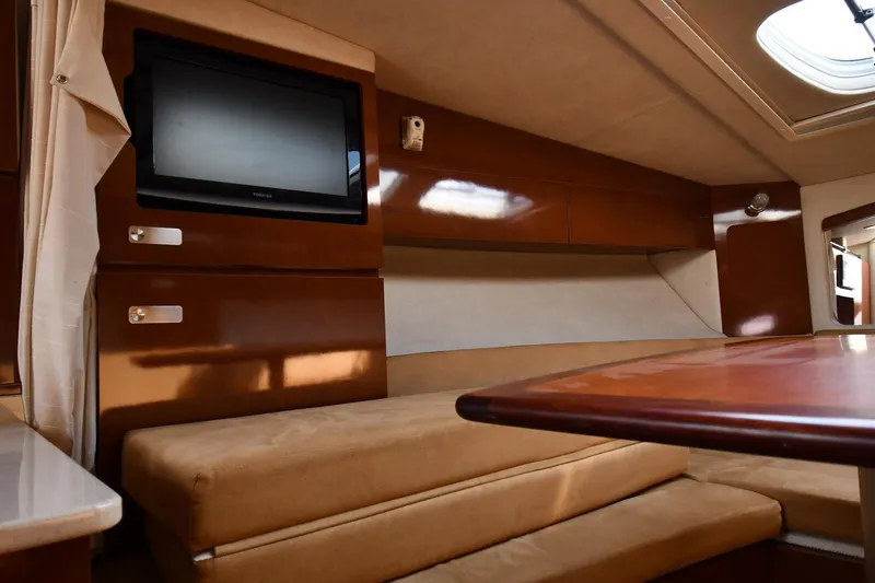 Slide: The Image of Interior of 2011 Sea Ray 310 Sundancer with TV and seating area. - 41
