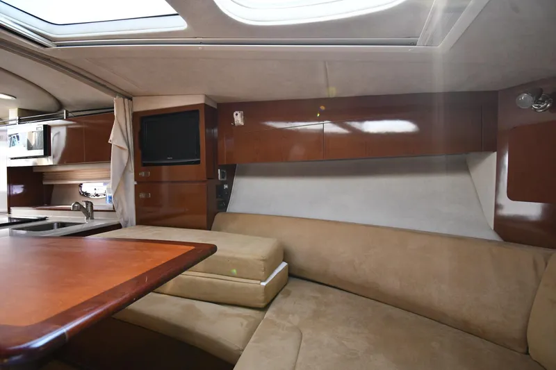 Slide: The Image of Interior of 2011 Sea Ray 310 Sundancer yacht with cozy seating and modern amenities. - 42