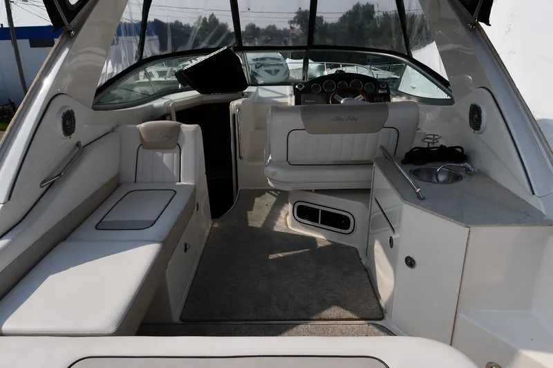 Slide: The Image of Interior of 2011 Sea Ray 310 Sundancer boat with seating and helm. - 9