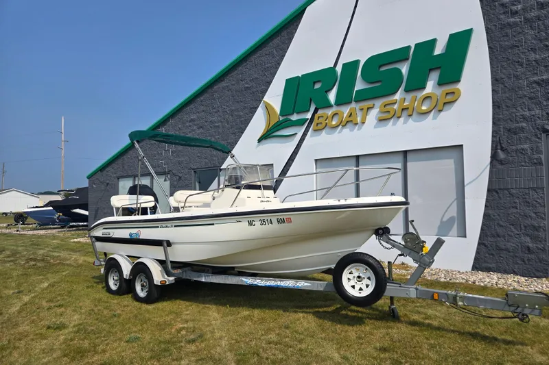 Slide: The Image of 1998 Boston Whaler 18 Dauntless boat on trailer outside Irish Boat Shop. - 3