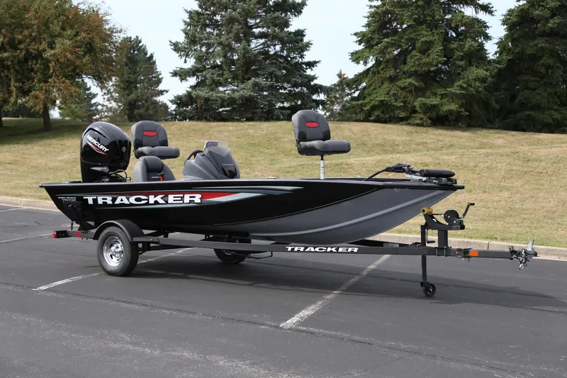The Image of 2026 Tracker Pro Team 175 boat on trailer in parking lot. - 0