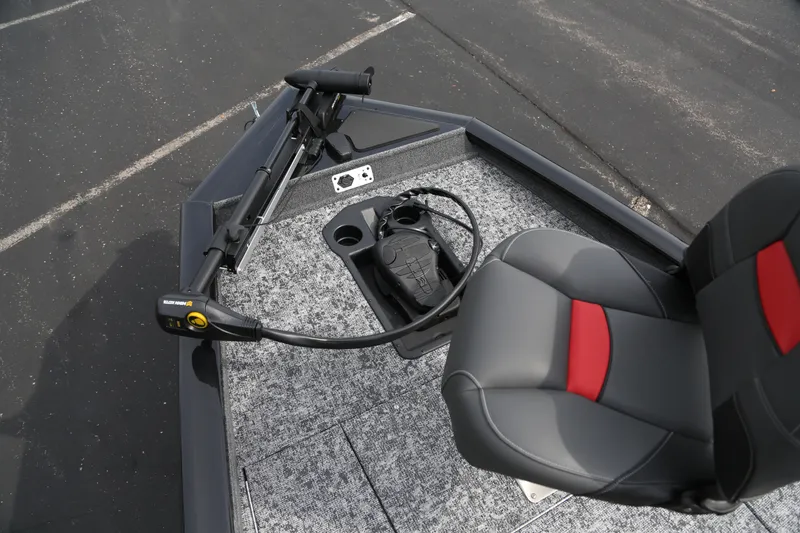 Slide: The Image of 2026 Tracker Pro Team 175 boat interior with seat and trolling motor. - 2