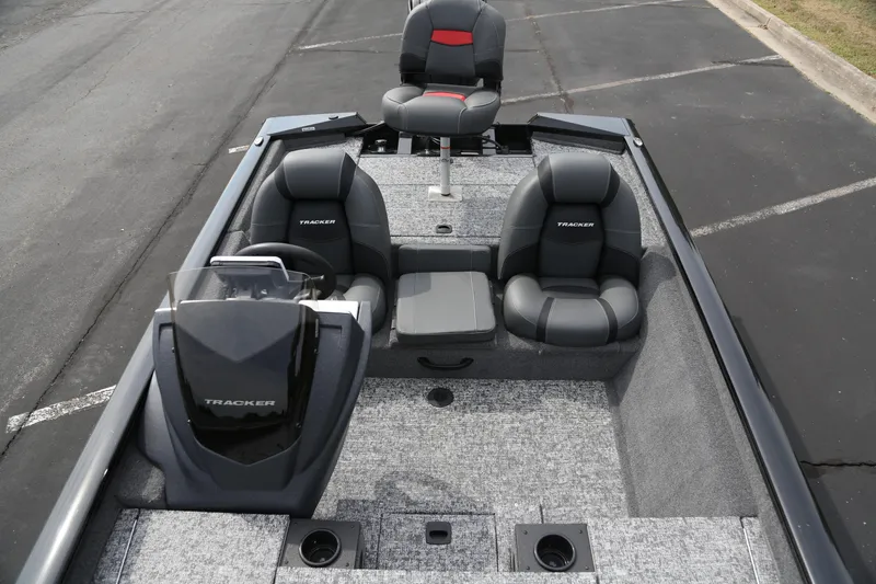 Slide: The Image of 2026 Tracker Pro Team 175 boat interior with gray seating and steering console. - 3