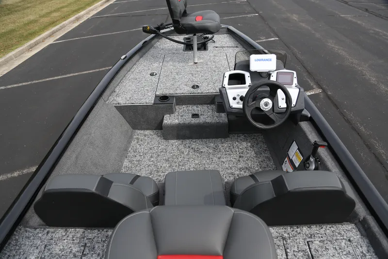 Slide: The Image of 2026 Tracker Pro Team 175 boat interior with steering console and seating. - 5