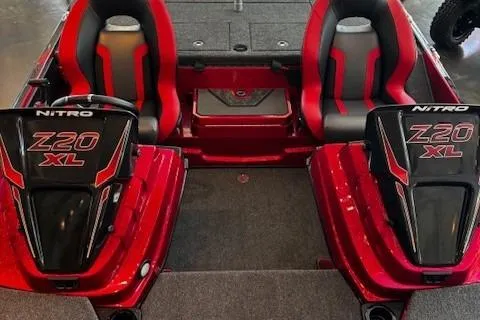 Slide: The Image of 2026 Nitro Z20 XL Pro boat interior with red and black seats. - 2
