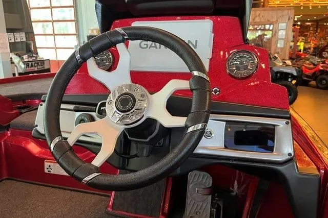 Slide: The Image of Steering wheel and dashboard of 2026 Nitro Z20 XL Pro boat, featuring modern controls. - 8
