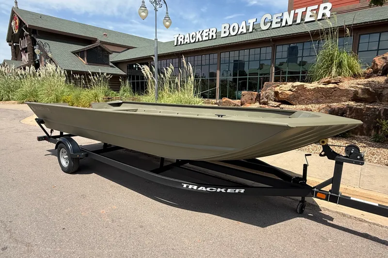 Slide: The Image of 2026 Tracker Grizzly 2072 Utility boat on trailer outside Tracker Boat Center. - 5