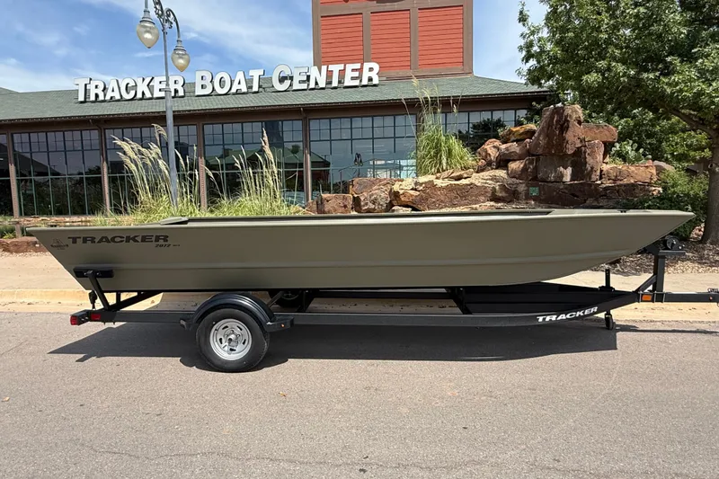 Slide: The Image of 2026 Tracker Grizzly 2072 Utility boat on trailer outside Tracker Boat Center. - 4