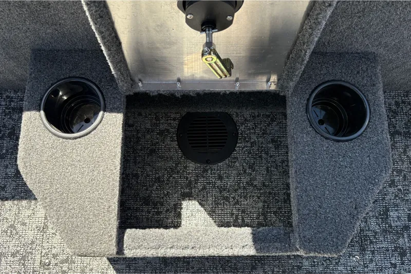 Slide: The Image of Interior of 2026 Tracker Targa V-18 WT boat with cup holders and carpeted flooring. - 41